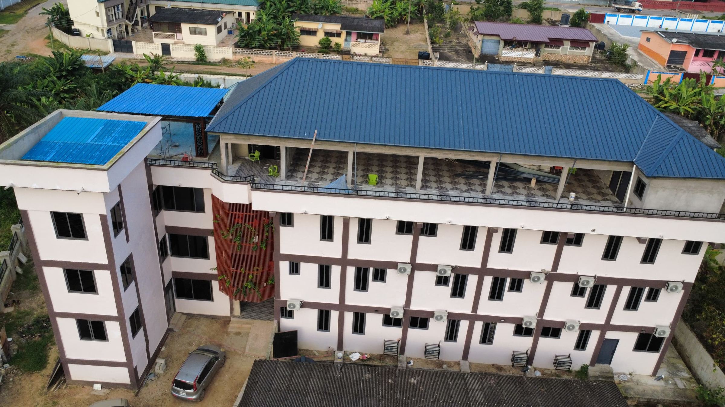 The JECAPH hostel building, showing the room windows and balconies